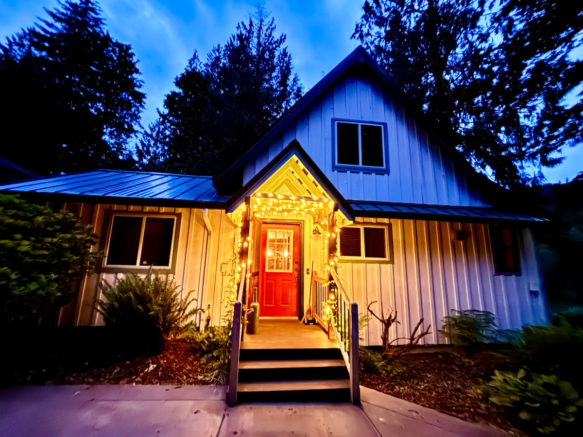 The welcoming cabin entrance glowing at dusk