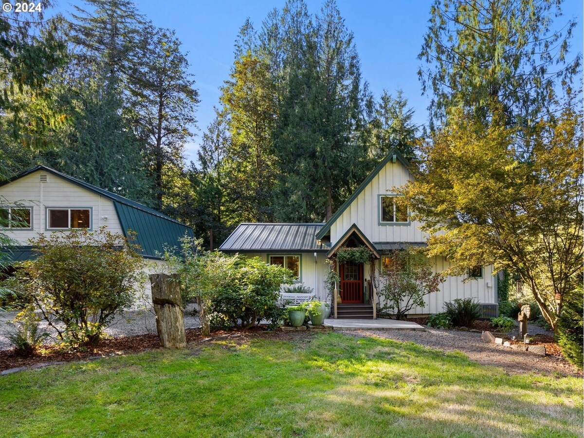 Sandy River's Hush cabin and lawn surrounded by trees