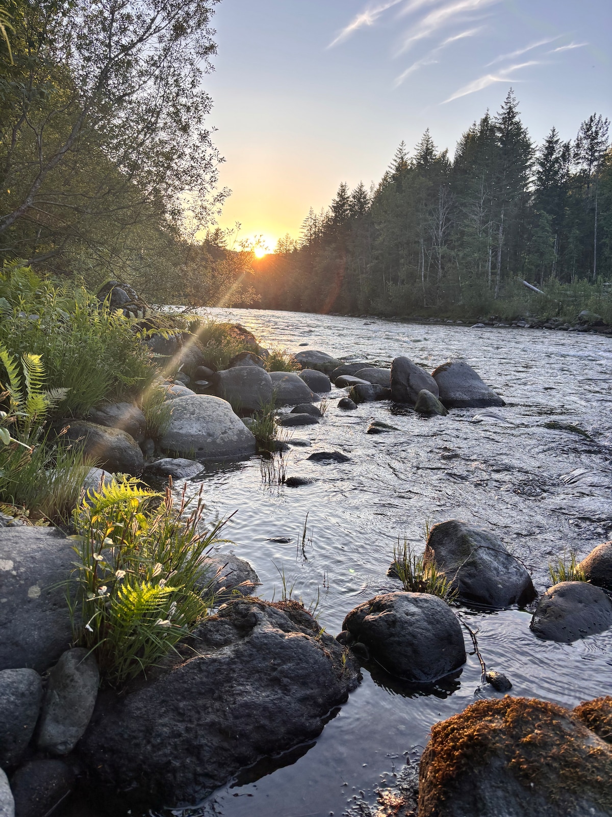 The Sandy River flowing past the property at sunset